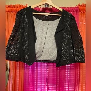 Lace, crop, mid sleeve, open front jacket. Grey lining, sheer in sleeve area.
